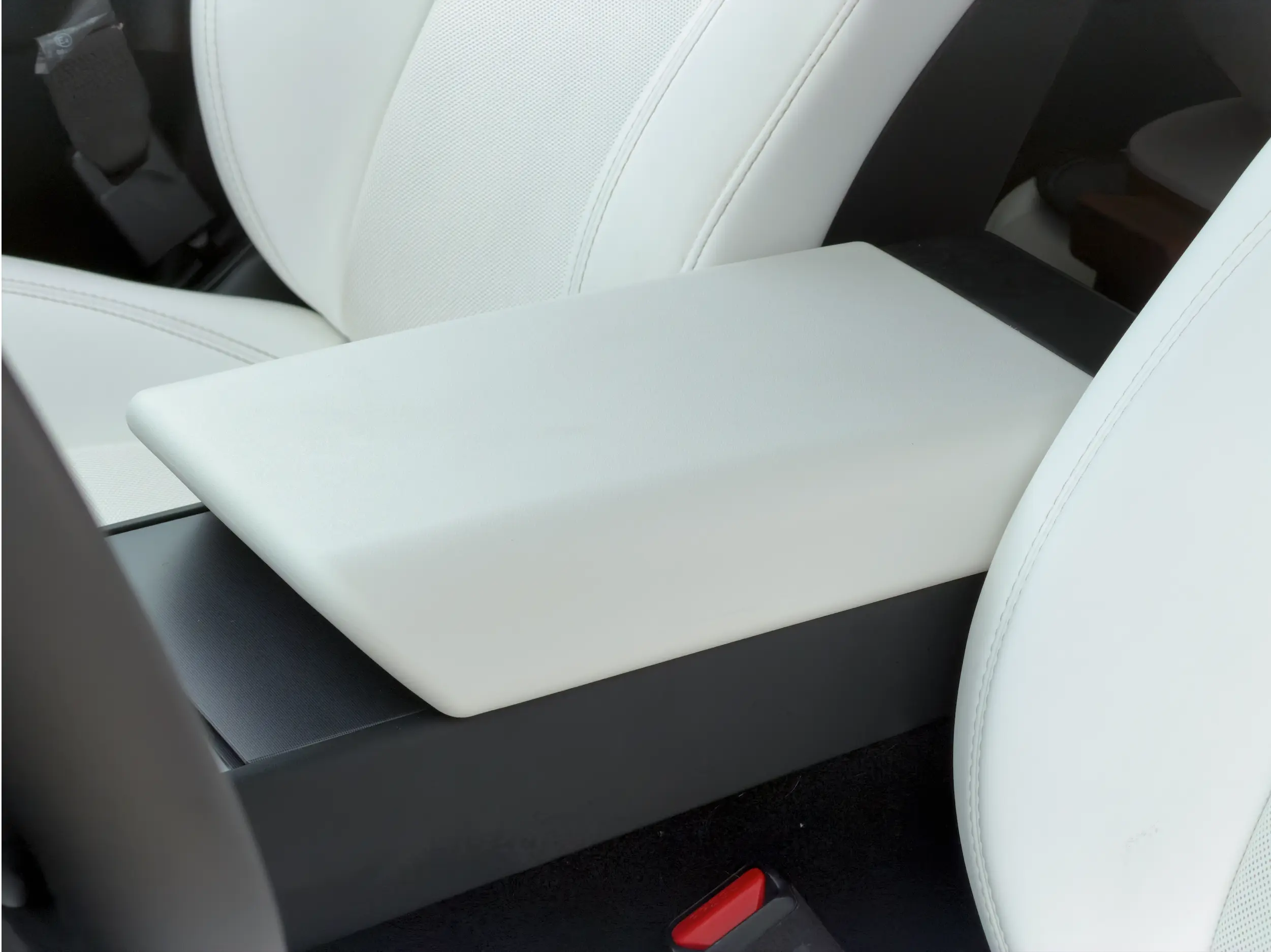 Tesgee™ armrest cover installed in a Tesla cabin
